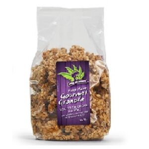 The image is showing a transparent packet with purple sticker labelled with HANDMADE GOURMET GRANOLA 1kg pack