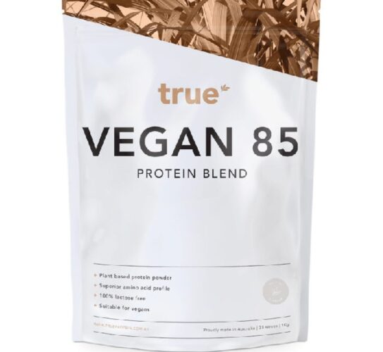 The image is showing a white packet labelled with True VEGAN 85 PROTEIN blend